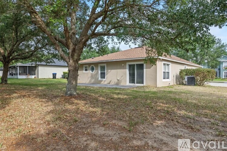 A house with a tree in front of it is for sale.