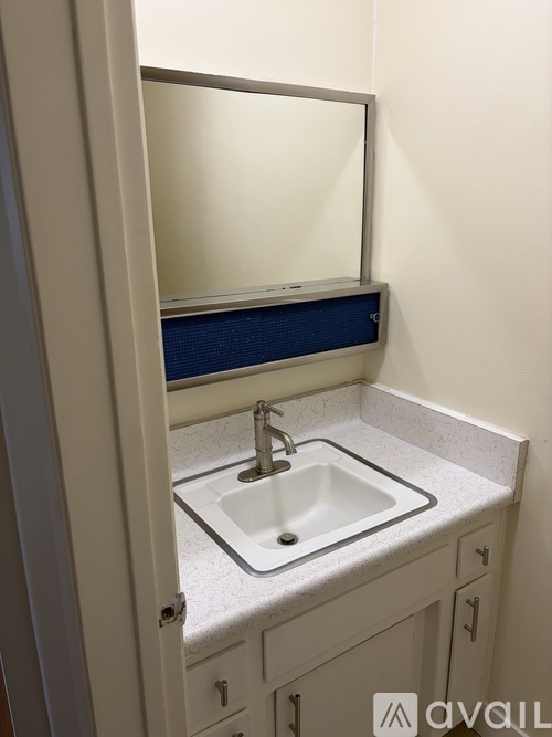 A bathroom sink with a mirror above it.