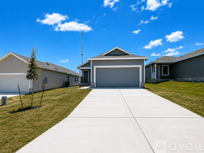 A modern house with a garage and a driveway.