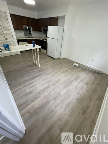 A kitchen with white appliances and a white refrigerator.