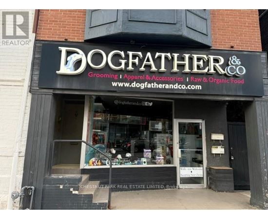 A storefront with a sign that reads "DOGFATHER & CO."