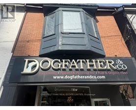 A storefront with a sign that reads "DOGFATHER & CO."