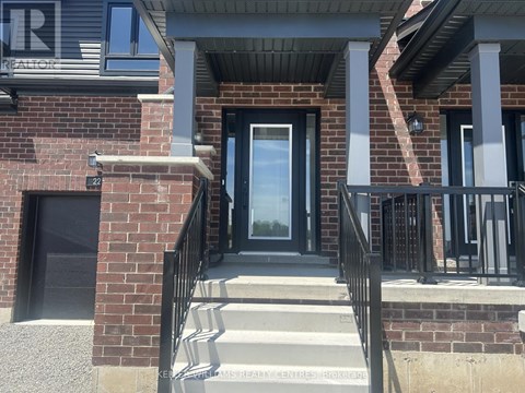 A house entrance with a black door and a glass window.