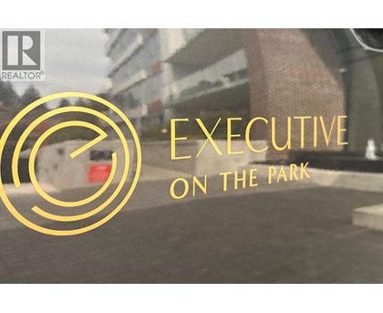 A logo with the text "EXECUTIVE ON THE PARK" in front of a blurry background.