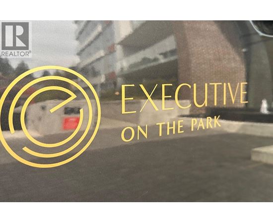 A logo with the text "EXECUTIVE ON THE PARK" in front of a blurry background.