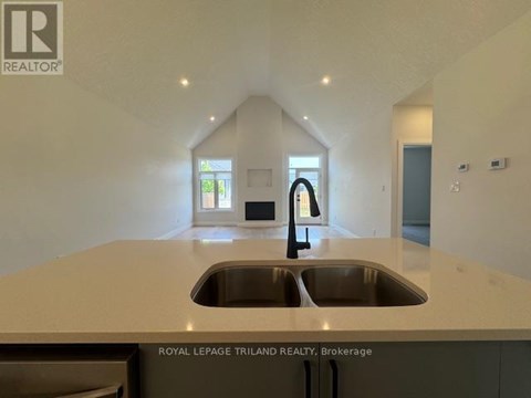 A modern kitchen with a sink and a window.