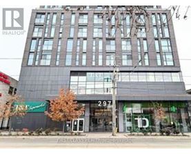 A tall building with a glass facade and a sign that reads "297" is in the foreground.