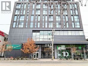 A tall building with a glass facade and a sign that reads "297" is in the foreground.