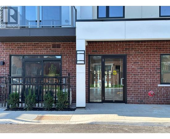 A building with a red brick facade and a glass door.