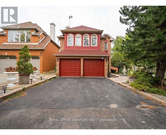 A house with a red garage door is for sale.