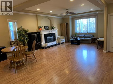 A living room with a fireplace and a couch.