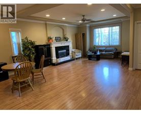 A living room with a fireplace and a couch.