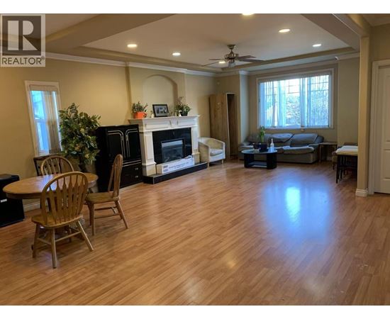 A living room with a fireplace and a couch.