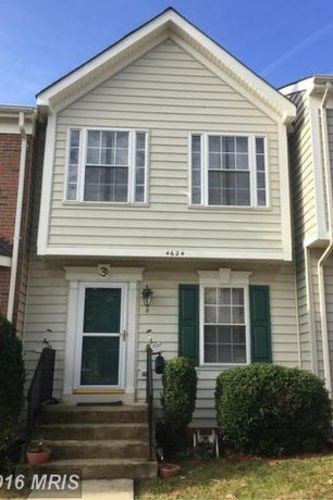 A house with the number 16 on the front door.