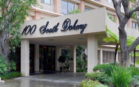 The front of a building with the words "100 South Doherty" written on it.