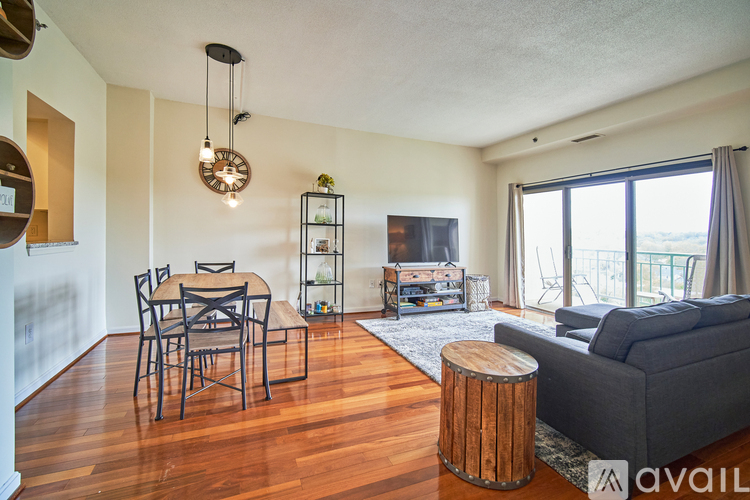 A living room with a dining table and chairs.