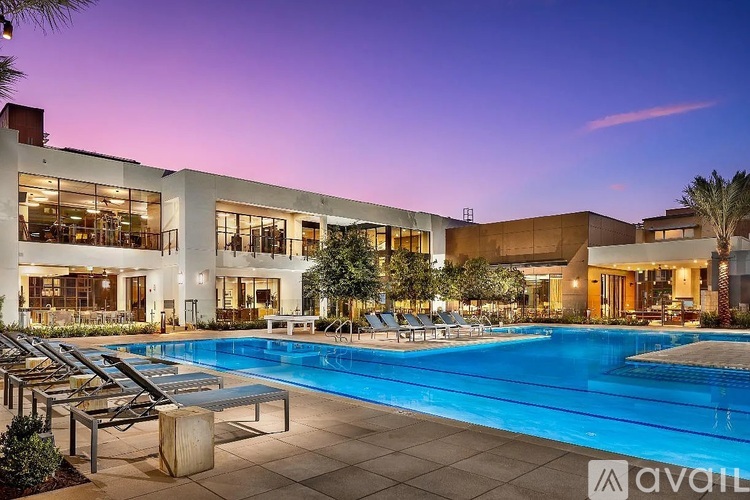 A modern house with a pool in the backyard.