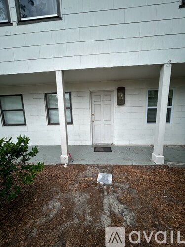 A white house with a door and windows.