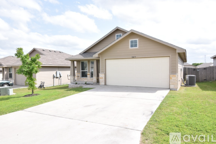 A house with a garage is available for sale.