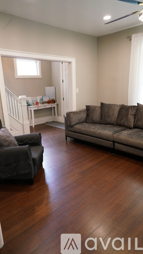 A living room with a couch and a chair.