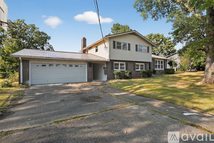 A house with a garage is for sale.