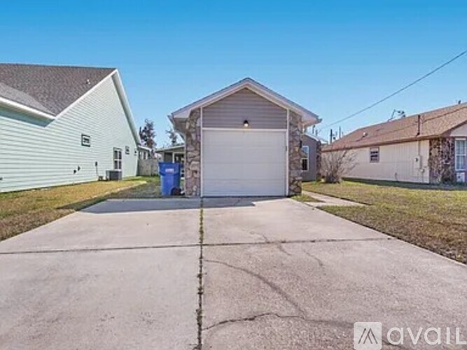 A house with a driveway in front of it.