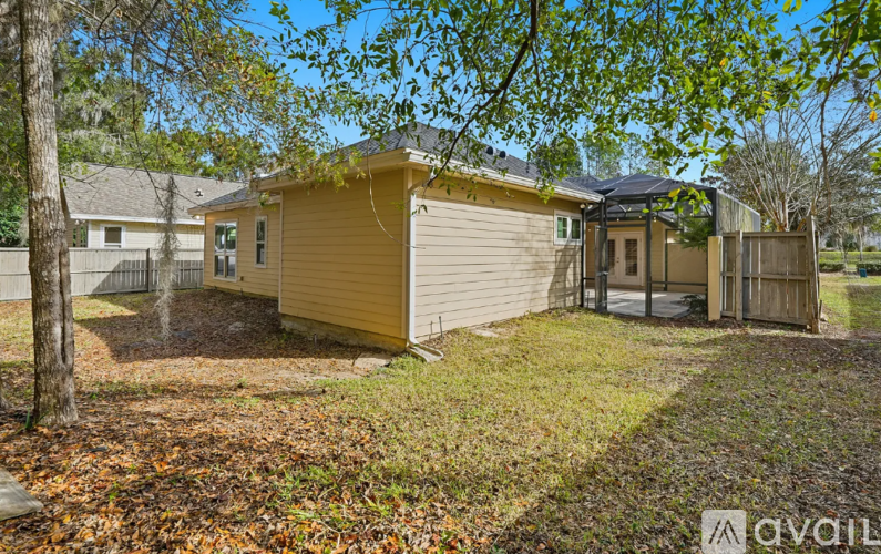A house with a yellow exterior is available for rent.
