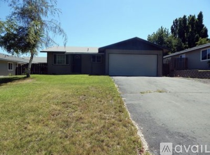 A house with a garage is available for sale.