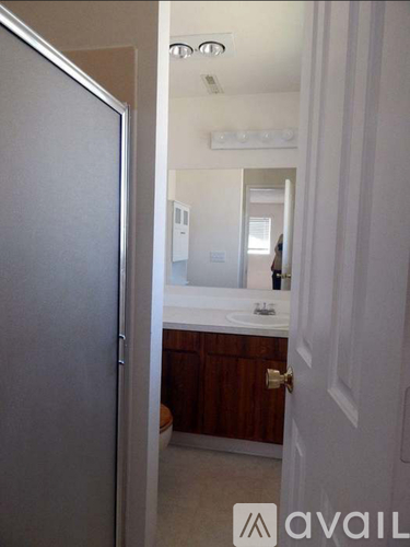 A bathroom with a sink and mirror.
