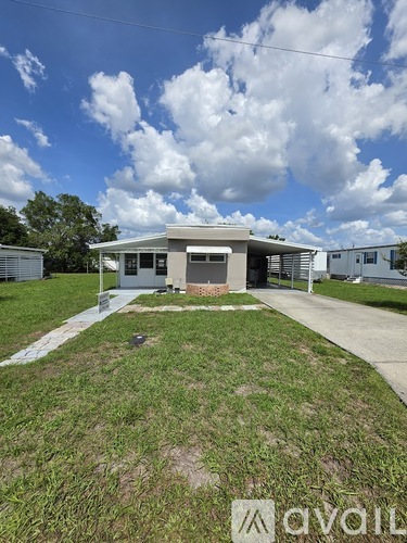 A house with a lawn in front of it is for sale.