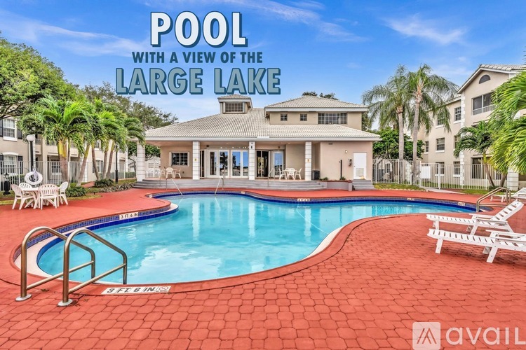 A pool with a view of the large lake.