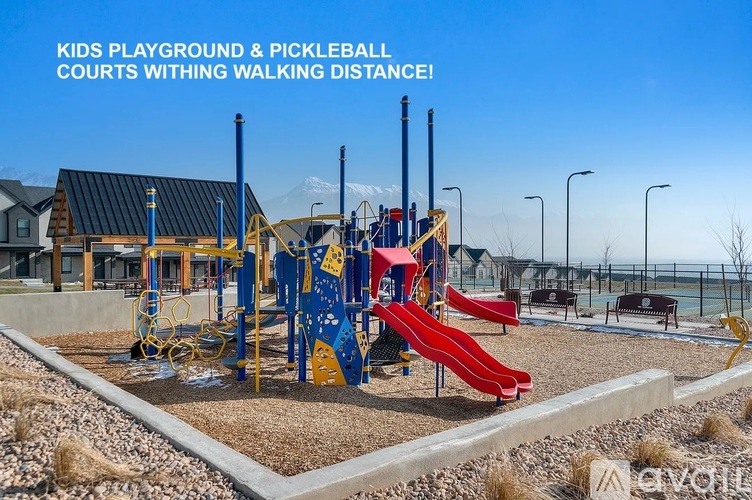 A playground with a slide, swings, and a climbing frame.