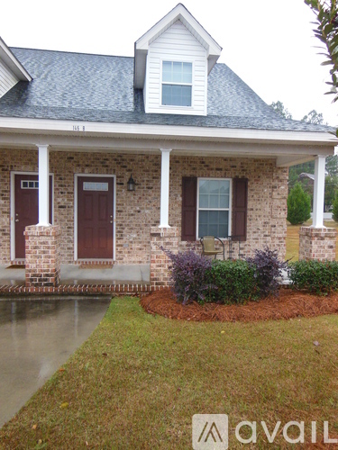 A house with a brown door and window.