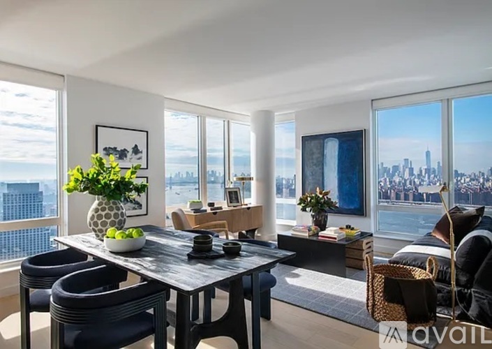 A modern dining room with a view of the city skyline.