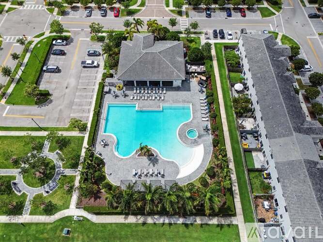 An aerial view of a house with a pool in the backyard.
