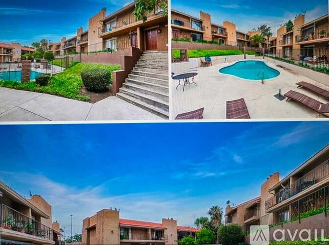 Apartment complex with a pool and a patio.