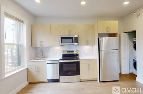 A kitchen with wooden cabinets and stainless steel appliances.