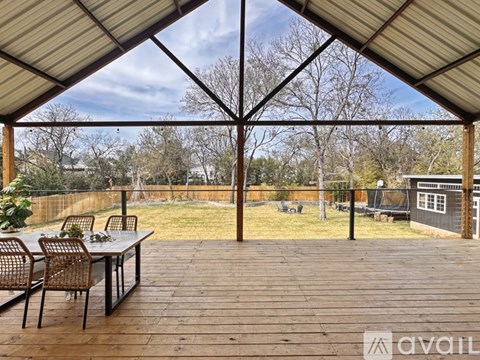 A patio with a table and chairs is available for rent.