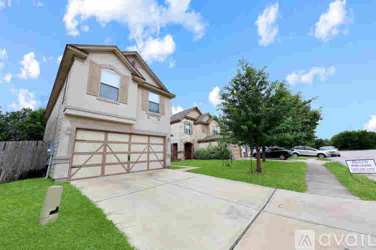 A house with a garage is for sale.