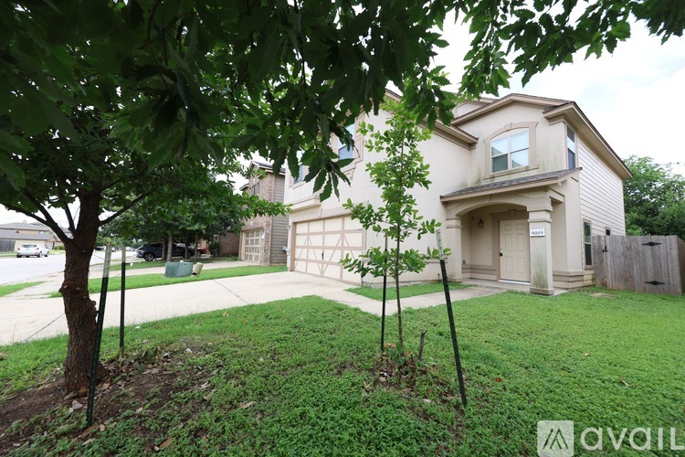 A house with a tree in front of it.