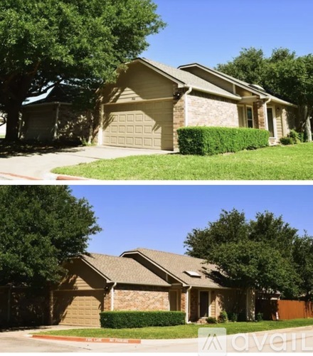 A house with a brown roof and a garage door.
