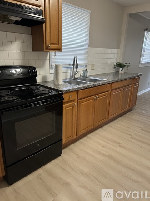 A black oven sits on a kitchen countertop.