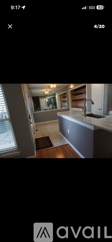 A kitchen with a sink and a window.