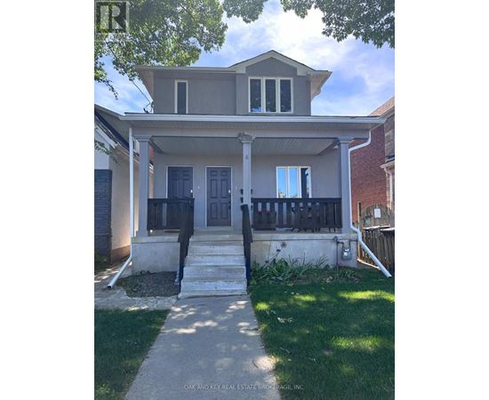 A house with a front porch and a black door.