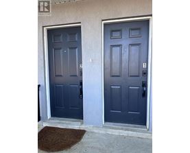 A pair of dark blue double doors with numbers 2 and 1 on them.