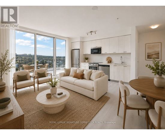 A living room with a couch, chairs, and a coffee table.