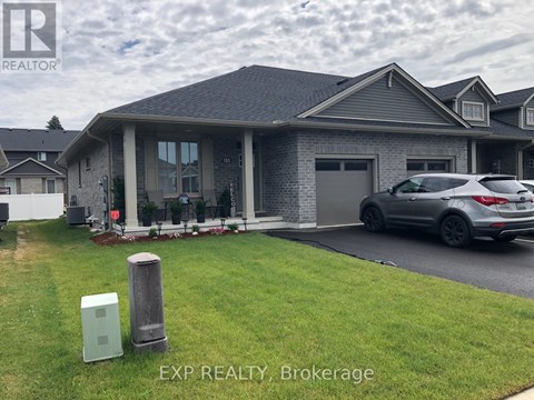 A house with a grey roof and a grey car parked in front.