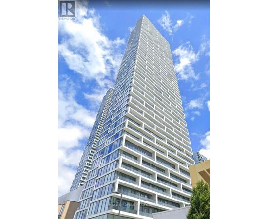 A tall building with a glass facade and a sign that reads "Metropole".