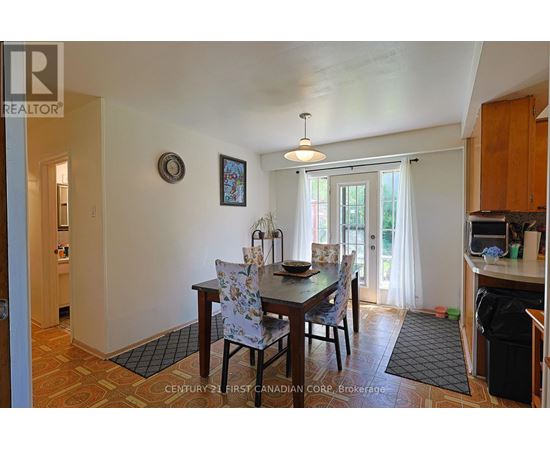 A dining room with a table set for two.