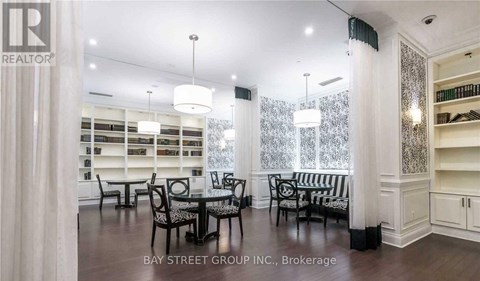 A dining room with a glass table and chairs.